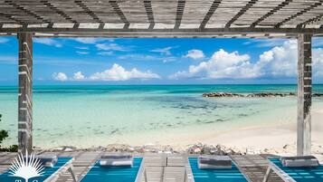 On the beach, sun loungers, beach towels