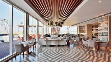 Breakfast, lunch, dinner served; Indian cuisine, pool views