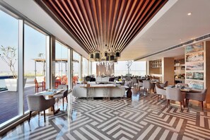 Breakfast, lunch, dinner served; Indian cuisine, pool views  - Marriott Executive Apartments Hyderabad (Hyderabad)