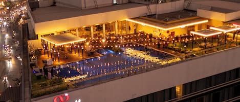 A Marriott Executive Apartments building with a rooftop pool area.