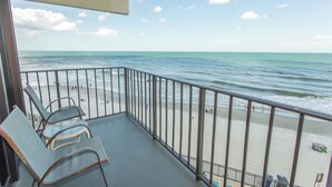 A balcony with a view of the beach and ocean. - OCEANFRONT LARGE 2 BEDROOM CONDO (Murrells Inlet)