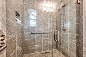 Shower, hair dryer, towels, shampoo