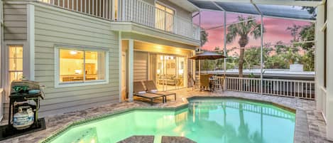 Watch the sky fade to pink from the warm spa waters as soft lighting transforms the pool and patio into your own private paradise.