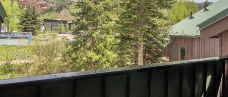 A mountain landscape with buildings and trees.