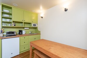 Fridge, microwave, stovetop, coffee/tea maker