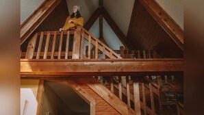 A wooden attic with a sloped ceiling and a balcony. - A-Frame #17 - Hosted by The Chalets (Logan)