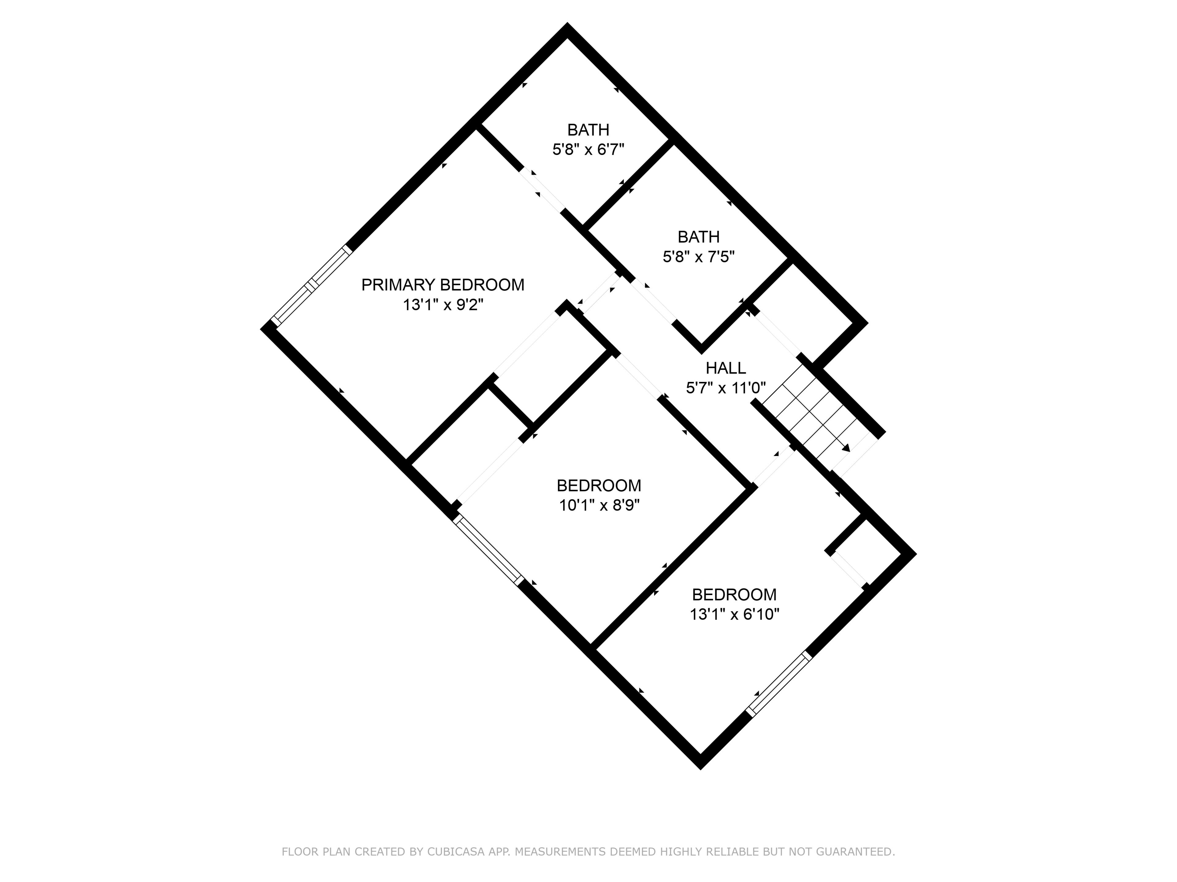 Un plan d’étage d’une maison comprenant une chambre principale, deux salles de bain, un hall et deux chambres.