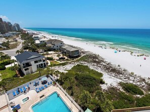 A resort with a pool, beach, and ocean view. - Beach Front, Free Beach Chair Service, Upgraded Linens! (Miramar Beach)