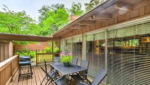 A covered patio with a table and chairs, a grill, and a potted plant. - Restful Winnsboro Family Home: Walk to Main Street (Winnsboro)