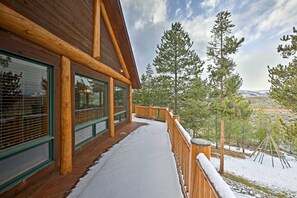 A wooden cabin with large windows and a snow-covered deck. - 2 Mi to Skiing: Mtn-View Home w/ Deck in Granby! (Granby)