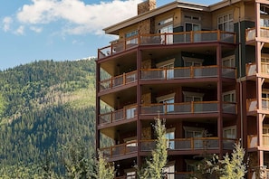 A multi-story hotel with balconies, set against a mountainous backdrop. - Westgate 4606 (Park City)