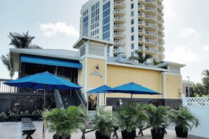 A building with a blue awning and a sign that reads "Flippers."