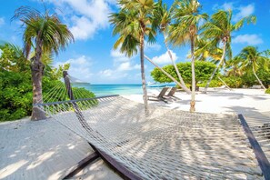 On the beach, sun loungers, beach towels