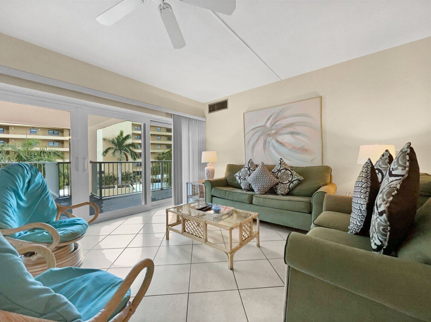 Living room open to the dining area with Gulf views through the windows