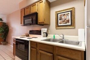 Fridge, microwave, stovetop, coffee/tea maker