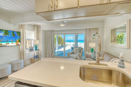 UPDATED OLD FLORIDA STYLE COTTAGE DIRECTLY ON THE BEACH!