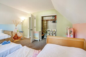 A child's bedroom with bunk beds, a wardrobe, and a play area. - Family Home w/ Hot Tub, 2 Mi to El Dorado Beach! (South Lake Tahoe)