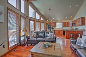 Relax in this inviting living area with a comfortable sofa, coffee table, and dining space.