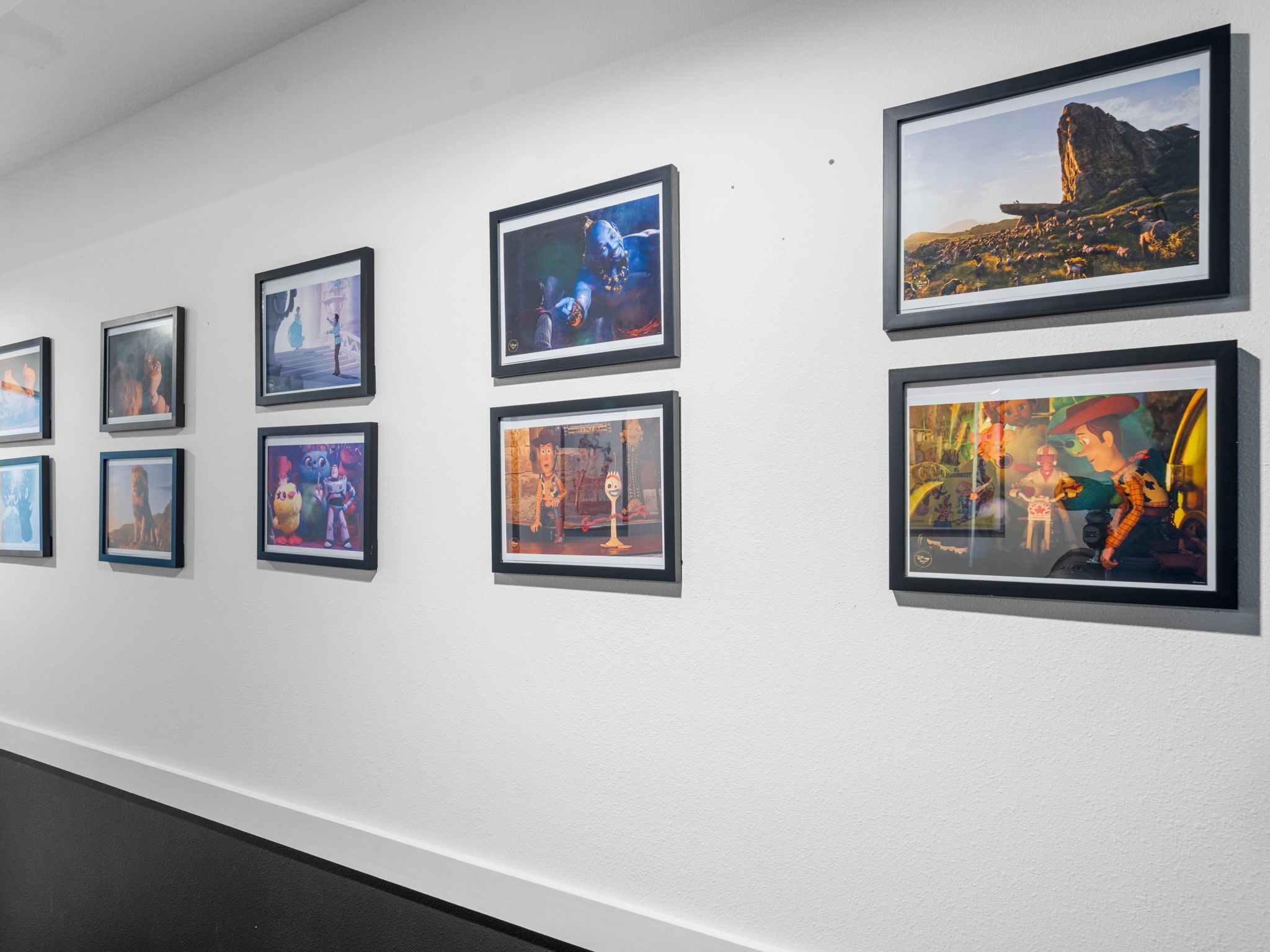 A gallery wall with framed artworks.