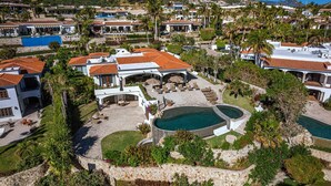 A large resort with multiple buildings, a central pool, and lush landscaping. - 2 FREE NIGHTS IN CABO at Casa Maravilla! (Palmilla)
