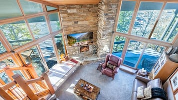 Flat-screen TV, fireplace, DVD player, stereo