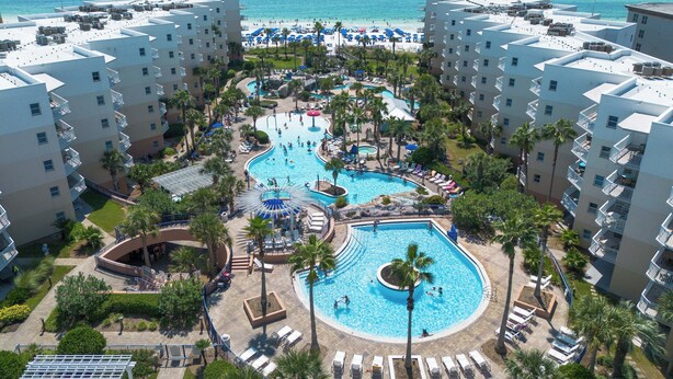 A resort with multiple swimming pools, a beach, and a view of the ocean. - WS B310: Resort Shores - The Perfect Gulf Retreat! (Fort Walton Beach)