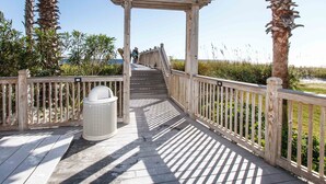 A wooden boardwalk leading to a pergola with a view of the beach. - WS B310: Resort Shores - The Perfect Gulf Retreat! (Fort Walton Beach)