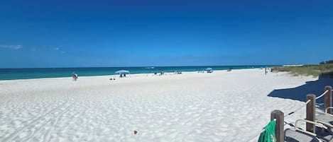 On the beach, sun loungers, beach towels