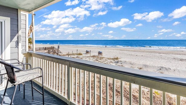A balcony with a view of a beach and ocean. - Completely Renovated Oceanfront Unit in Quaint Surfside Beach! SC205b (Surfside Beach)