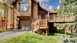 A two-story house with a front garage, a wooden deck, and a covered porch. - Private Hot Tub + Deck: Breckenridge Abode! (Breckenridge)