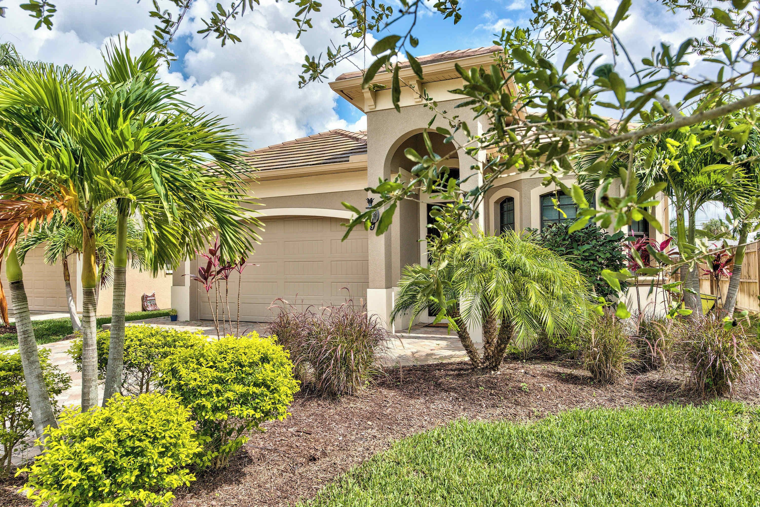 Exterior of Home, Lush lawn and tropical landscaping