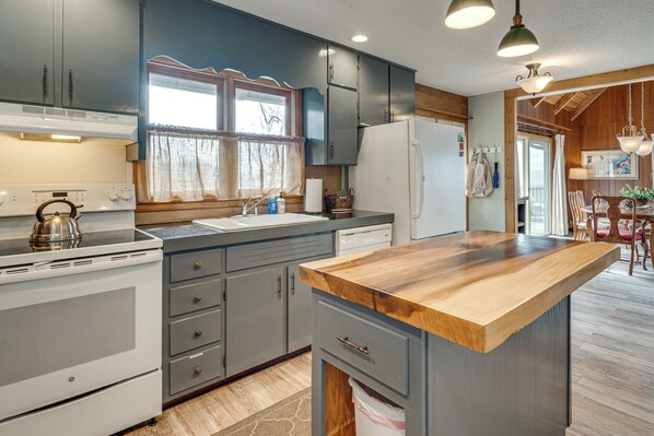 A kitchen with a wooden countertop, white appliances, and grey cabinets. - 'Point of View' Hilltop Sanctuary in Brevard (Brevard)
