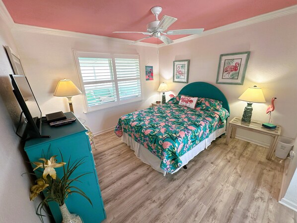 A bedroom with a bed, a desk, a ceiling fan, and a window with blinds. - KH5205- Oceanfront, 4 BRs (2 Masters), Hot Tub & Outstanding Ocean Views! (Kitty Hawk)