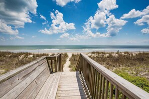 A wooden boardwalk leading to a beach with a clear view of the ocean and sky. - Oceanfront just Steps to the Beach - Short Drive to Dining/shops CC II 101 (Surfside Beach)