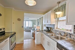 Enjoy cooking in this well-equipped kitchen with a double sink and ample counter space.