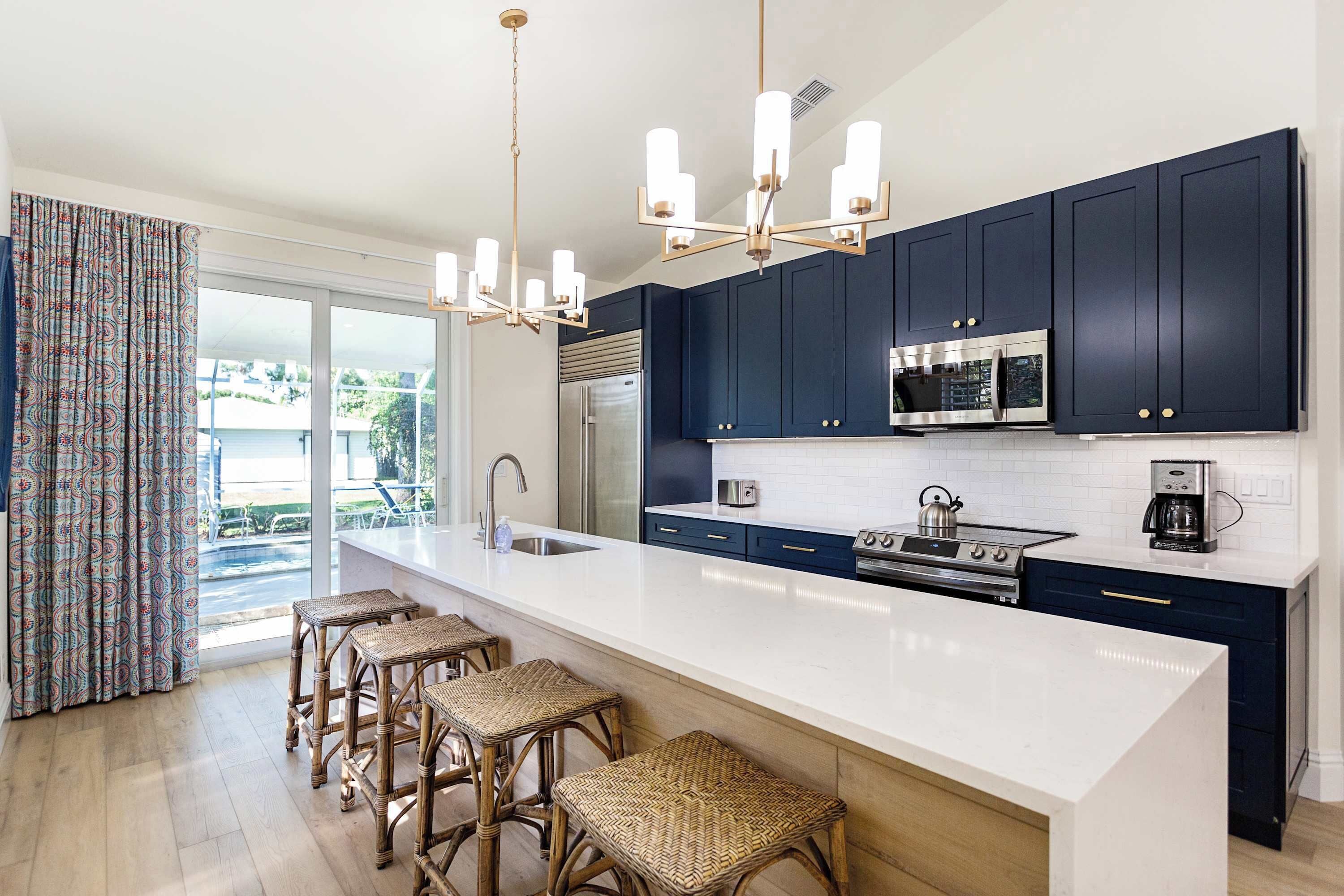 Fully updated and stocked kitchen with access to the pool