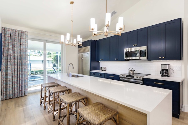 Fully updated and stocked kitchen with access to the pool