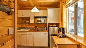 Fridge, microwave, coffee/tea maker, cookware/dishes/utensils