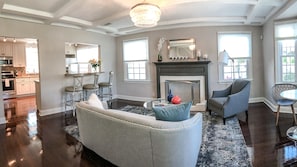 Cozy living space with a fireplace, dining area, and kitchen.