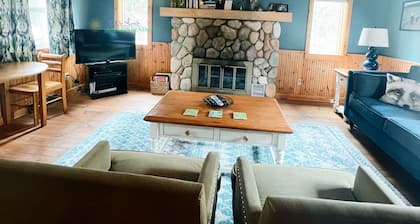 Cottage in Glen Arbor with Crystal River frontage, canoe, FP, A/C, Dogs ok