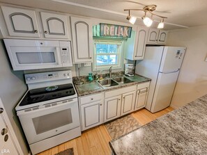 Fridge, microwave, stovetop, dishwasher - The Cottage - 2 BR Beach Bungalow near Nightlife! (Surf City)