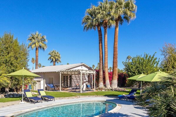 A heated pool, pool loungers