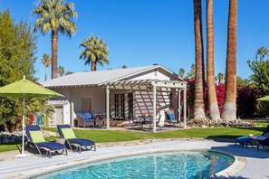 A heated pool, pool loungers