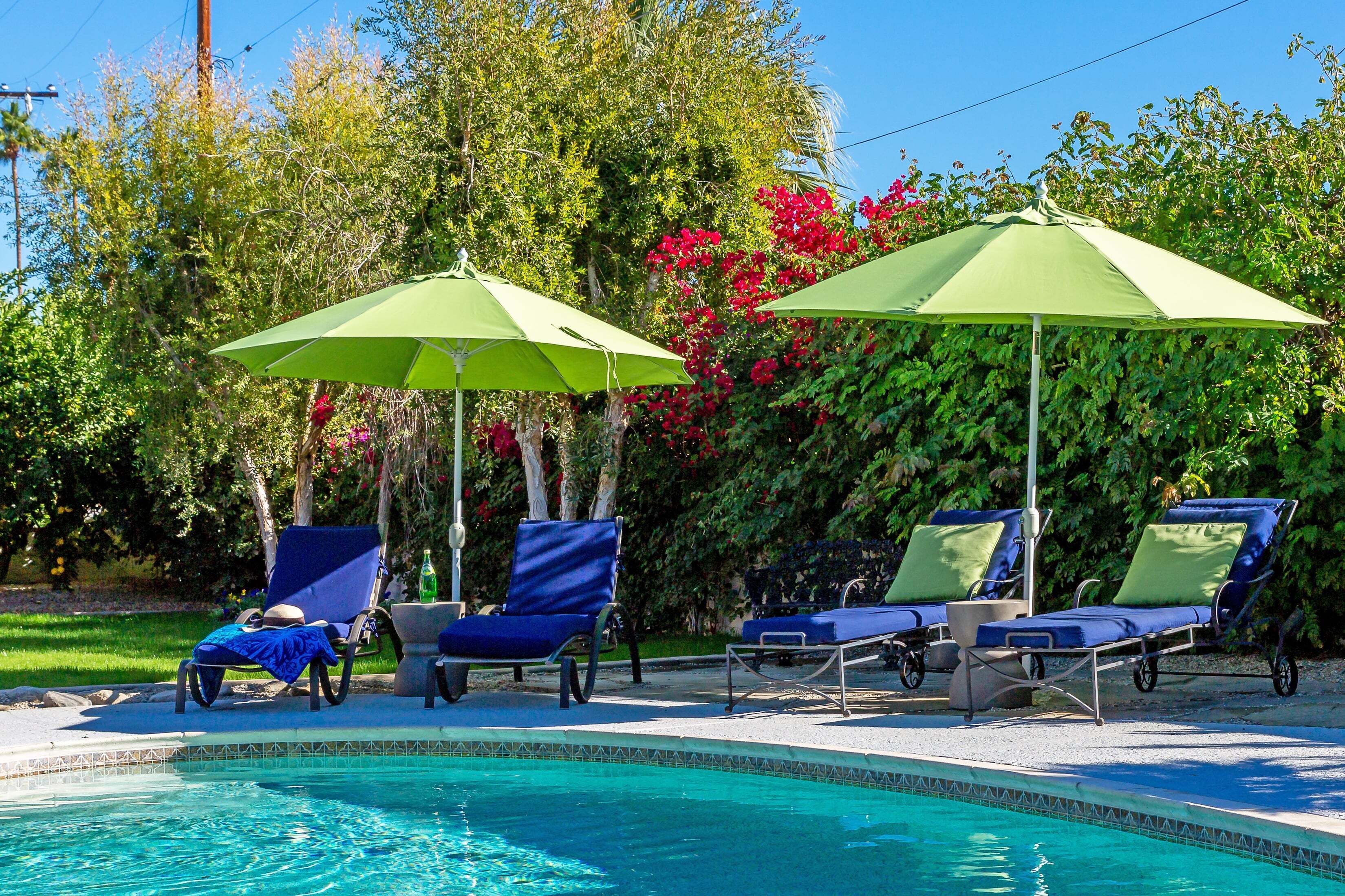 A heated pool, sun loungers