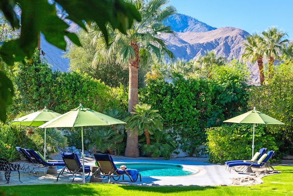 A heated pool, pool loungers