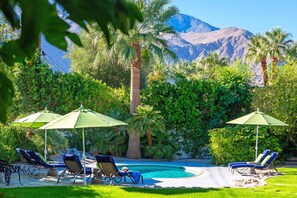 A heated pool, pool loungers