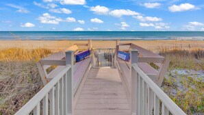 A wooden boardwalk leading to a beach with a clear view of the ocean. - Sweet Carolina - Perfect Surfside Oceanfront Location! (Surfside Beach)