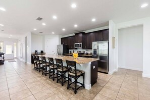 Fridge, microwave, oven, stovetop - Polished Sleek Home with Backyard Pool at Encore (Kissimmee)