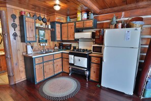 Fridge, microwave, oven, stovetop - Three-bedroom with three queen beds and sofa sleeper, lake front on Big Round (Hayward)