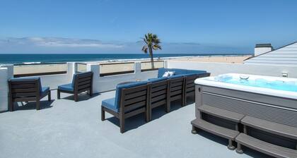 Beautiful, one-of-a-kind upper unit with incredible roof-top deck with hot tub
